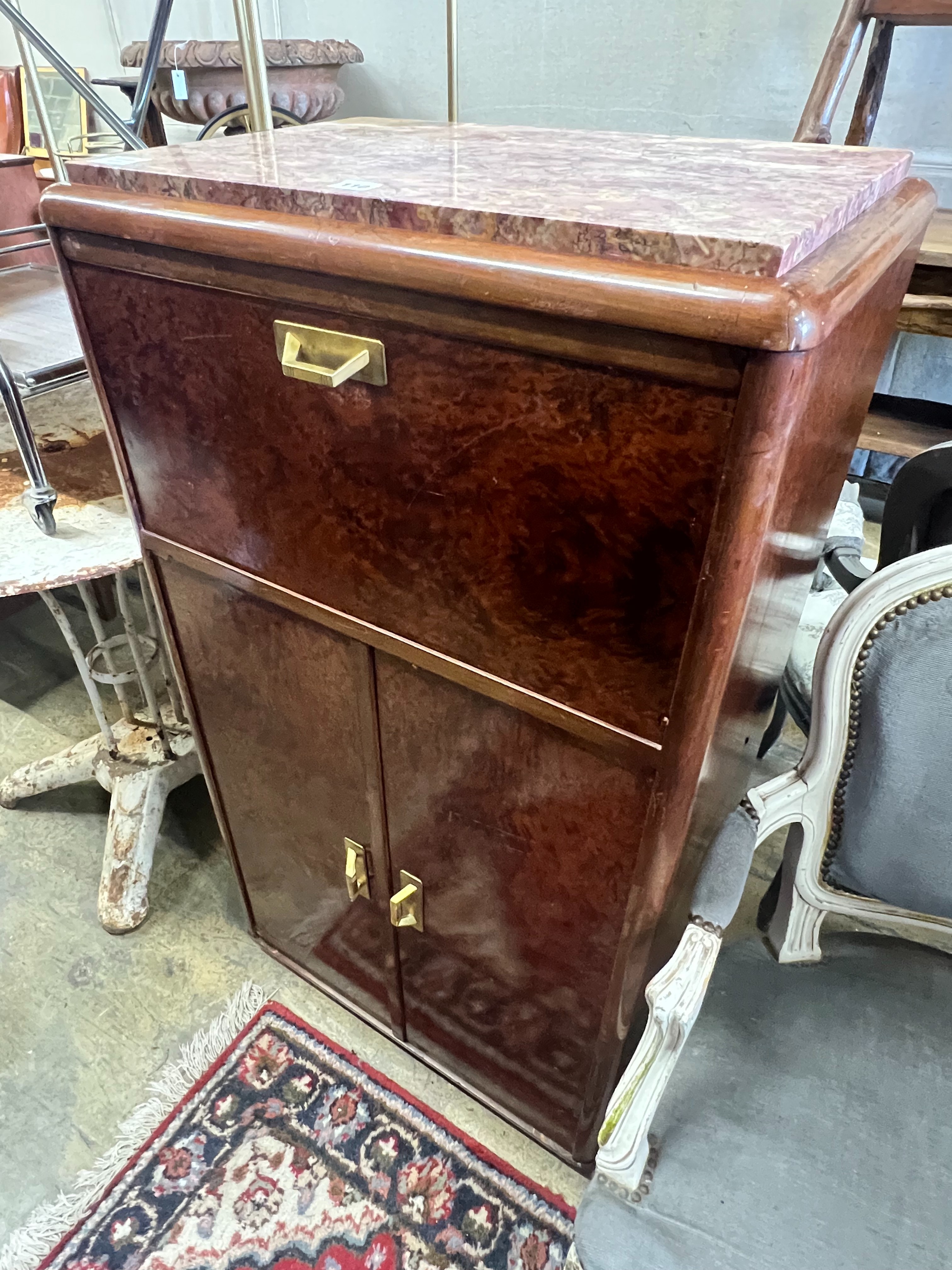 A French Art Deco style amboyna veneered marble topped drinks cabinet, width 61cm depth 40cm height 113cm